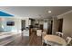 Open-concept kitchen with modern appliances and dark granite countertops at 2749 Sand Oak Loop, Apopka, FL 32712