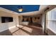 Open-concept living room with wood-look tile flooring and access to kitchen and dining area, offering a bright and airy feel at 2749 Sand Oak Loop, Apopka, FL 32712