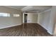 Open-concept living area featuring tiled floors, neutral walls, and plenty of natural light at 2749 Sand Oak Loop, Apopka, FL 32712