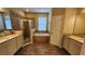 Bathroom with double sinks, granite countertops, walk-in shower, and soaking tub at 2749 Sand Oak Loop, Apopka, FL 32712