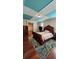 Bedroom with hardwood flooring, decorative ceilings and an ensuite bathroom and closet at 2749 Sand Oak Loop, Apopka, FL 32712