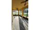 Enclosed patio with ceiling fans, large windows, and a view of the yard, perfect for relaxation at 2749 Sand Oak Loop, Apopka, FL 32712