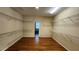 Spacious walk-in closet with wire shelving and hardwood flooring at 2749 Sand Oak Loop, Apopka, FL 32712