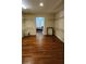 Spacious walk-in closet features wood floors and hanging racks offering ample storage at 2749 Sand Oak Loop, Apopka, FL 32712