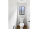 Powder room featuring a toilet with a frosted window and vinyl wood floor at 3951 Haynes Cir, Casselberry, FL 32707