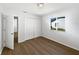 Light bedroom with closet and view of a neighbor's house at 3951 Haynes Cir, Casselberry, FL 32707