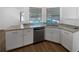 Kitchen featuring granite countertops, stainless steel appliances and wood vinyl flooring at 3951 Haynes Cir, Casselberry, FL 32707