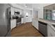 Clean kitchen featuring stainless steel appliances, granite countertops, and white cabinetry at 3951 Haynes Cir, Casselberry, FL 32707