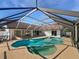 Inviting in-ground pool and spa with a screened enclosure overlooking the backyard at 3951 Haynes Cir, Casselberry, FL 32707