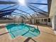 Inviting in-ground pool and patio area enclosed by a screen providing a private outdoor space at 3951 Haynes Cir, Casselberry, FL 32707