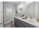 Bathroom with dual vanity, modern fixtures, and stylish tile flooring at 435 Lincoln Ave, Oviedo, FL 32766