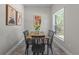 Bright dining room with natural light, modern art, and stylish decor at 435 Lincoln Ave, Oviedo, FL 32766