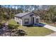 An exterior view of the front of a single-story home with a manicured lawn at 435 Lincoln Ave, Oviedo, FL 32766