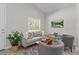 Bright living room featuring stylish furniture, a decorative rug, and a modern television at 435 Lincoln Ave, Oviedo, FL 32766