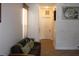 Hallway is illuminated by natural light from window and overhead lighting at 4964 Luge Ln, Orlando, FL 32839