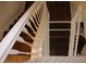 Classic wooden stairway featuring a white railing, and durable stair covering at 4964 Luge Ln, Orlando, FL 32839