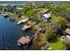 Breathtaking aerial shot of a waterfront property with private docks and lush greenery at 5243 W Lake Butler Rd, Windermere, FL 34786