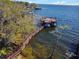 Aerial shot showcases the dock leading to boathouse and deep water access at 5243 W Lake Butler Rd, Windermere, FL 34786