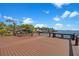 Spacious wooden deck with waterfront views, perfect for outdoor relaxation and entertaining at 5243 W Lake Butler Rd, Windermere, FL 34786