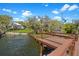 Scenic view from dock to home with boat house, waterfront living at its best at 5243 W Lake Butler Rd, Windermere, FL 34786