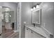 Powder room with granite countertops and an arched entryway at 5243 W Lake Butler Rd, Windermere, FL 34786