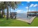 Beautiful waterfront property featuring a private sandy beach and a covered boat dock at 5243 W Lake Butler Rd, Windermere, FL 34786