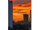 Dramatic skyline sunset over downtown buildings creating a vibrant cityscape at 530 E Central Blvd # 705, Orlando, FL 32801