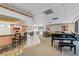 Spacious clubhouse featuring a baby grand piano, bar, and comfortable seating arrangements at 530 E Central Blvd # 705, Orlando, FL 32801