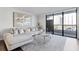 Bright living room with large windows, stylish decor, and a comfortable sectional sofa at 530 E Central Blvd # 705, Orlando, FL 32801