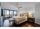 Cozy main bedroom with city views and a ceiling fan at 530 E Central Blvd # 705, Orlando, FL 32801