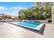 Stunning outdoor pool surrounded by lounge chairs and landscaping at 530 E Central Blvd # 705, Orlando, FL 32801