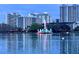 Beautiful lakefront view with a decorative fountain and city buildings, a tranquil cityscape scene at 530 E Central Blvd # 705, Orlando, FL 32801