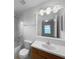 Clean bathroom with tub and shower combo, a single sink vanity, and light fixtures at 546 Koala Dr, Kissimmee, FL 34759