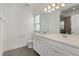 Bright bathroom featuring a double vanity with white cabinets and quartz countertop, plus a walk-in shower at 6633 Calamondin Dr, Winter Garden, FL 34787