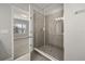 Modern bathroom boasts a glass-enclosed shower with gray tile and updated fixtures at 6633 Calamondin Dr, Winter Garden, FL 34787