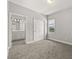 Cozy bedroom showcasing a double door closet and a bathroom for ultimate convenience at 6633 Calamondin Dr, Winter Garden, FL 34787