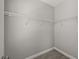 Walk-in closet space features a wire shelving system to maximize storage at 6633 Calamondin Dr, Winter Garden, FL 34787