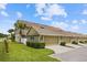 Charming townhome featuring a two-car garage, manicured lawn, and lush landscaping at 6633 Calamondin Dr, Winter Garden, FL 34787