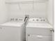 A laundry room featuring a newer washer and dryer at 6633 Calamondin Dr, Winter Garden, FL 34787