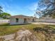 Rear exterior of the home featuring a patio and well-maintained yard at 760 Park Ave, Orange City, FL 32763