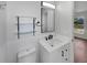 Well-lit bathroom with modern fixtures, a sleek vanity, and glass shelving at 760 Park Ave, Orange City, FL 32763