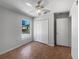 Inviting bedroom featuring a closet, window, and a ceiling fan for added comfort at 760 Park Ave, Orange City, FL 32763