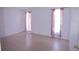 Empty bedroom with tile floors, neutral walls, and ample natural light at 763 Royal Palm Dr, Kissimmee, FL 34743