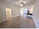 The expansive living room features wood floors and ample space for entertaining at 7732 Sloewood Dr, Leesburg, FL 34748