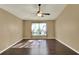 Bedroom with hardwood floors, ceiling fan and abundant natural light at 9649 Water Fern Cir, Clermont, FL 34711