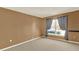 Bedroom featuring carpeted floors, window with curtains, and neutral wall paint at 9649 Water Fern Cir, Clermont, FL 34711