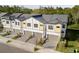 Aerial view of modern townhomes with neat landscaping and gray roofs at 10359 Ebb Tide Ln, Orlando, FL 32821