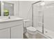 Well-lit bathroom with a shower, toilet, and modern vanity sink at 10359 Ebb Tide Ln, Orlando, FL 32821