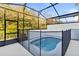 Backyard enclosed pool with black-frame screen and privacy fence at 10359 Ebb Tide Ln, Orlando, FL 32821