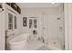 Elegant bathroom featuring a soaking tub, walk-in shower, and natural light at 1080 Edmiston Pl, Longwood, FL 32779